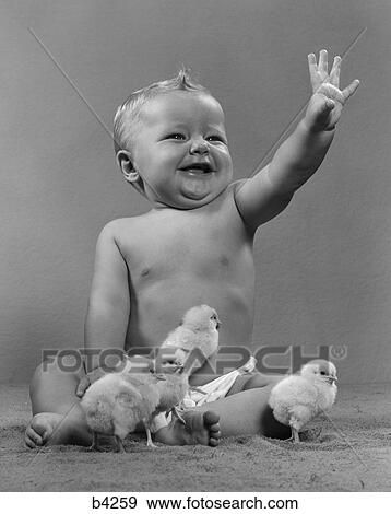 1950s laughing waving baby surrounded by little chicks View Large Photo Image Stock Photo - 1950s laughing waving baby surrounded by little chicks. Fotosearch