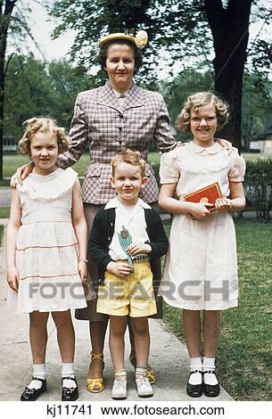 1950s mother and three children all dressed up posing for photo outdoors View Large Photo Image Stock Image - 1950s mother and three children all dressed up posing for photo outdoors. Fotosearch