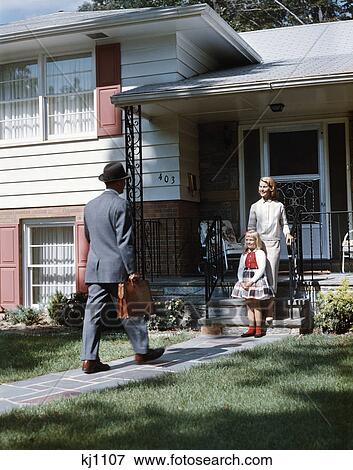 1950s mother daughter waiting steps house for father briefcase coming home suburban family man woman girl View Large Photo Image Stock Photo - 1950s mother daughter waiting steps house for father briefcase coming home suburban family man woman girl. Fotosearch