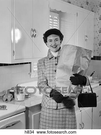 1950s woman shopping food kitchen View Large Photo Image Picture - 1950s woman shopping food kitchen. Fotosearch