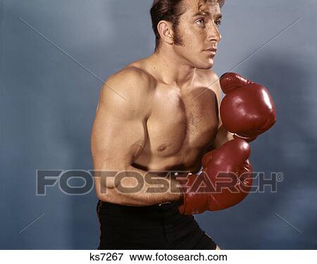 1960s 1970s head chest man boxer profile red boxing gloves View Large Photo Image Stock Photo - 1960s 1970s head chest man boxer profile red boxing gloves. Fotosearch