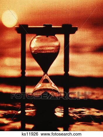 1960s 1970s hourglass sand beach sunset linen texture effect View Large Photo Image Stock Photograph - 1960s 1970s hourglass sand beach sunset linen texture effect. Fotosearch