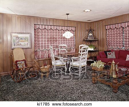1960s 1970s living room interior shag wall to wall carpet bentwood rocker red stripe roman shades View Large Photo Image Stock Photography - 1960s 1970s living room interior shag wall to wall carpet bentwood rocker red stripe roman shades. Fotosearch