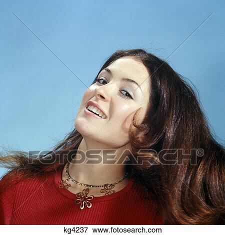 1960s 1970s portrait of smiling woman tossing her long brown hair wearing red top View Large Photo Image Stock Photo - 1960s 1970s portrait of smiling woman tossing her long brown hair wearing red top. Fotosearch