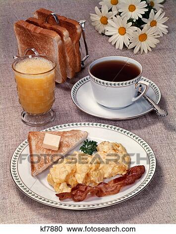 1960s 1970s Scrambled Eggs Bacon Toast On Dish Glass Orange Juice Toast In Rack Cup Of Coffee Daisies Breakfast Stock Image Kf70 Fotosearch