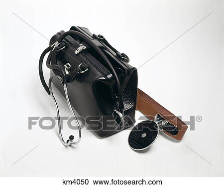 1960s 1970s still life black leather doctors bag stethoscope examination mirror house calls View Large Photo Image Stock Image - 1960s 1970s still life black leather doctors bag stethoscope examination mirror house calls. Fotosearch