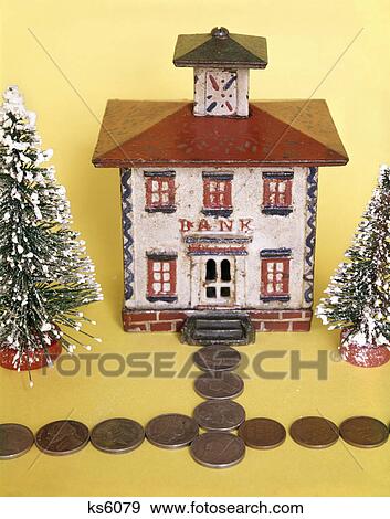 1960s 1970s still life of antique coin bank shaped like bank building with coin sidewalk View Large Photo Image Stock Photo - 1960s 1970s still life of antique coin bank shaped like bank building with coin sidewalk. Fotosearch