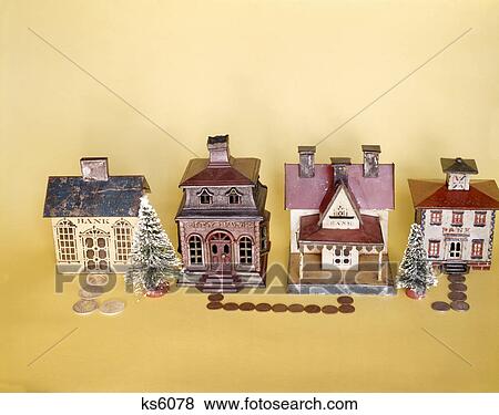 1960s 1970s still life row of four antique metal coin banks shaped like bank buildings View Large Photo Image Stock Photo - 1960s 1970s still life row of four antique metal coin banks shaped like bank buildings. Fotosearch