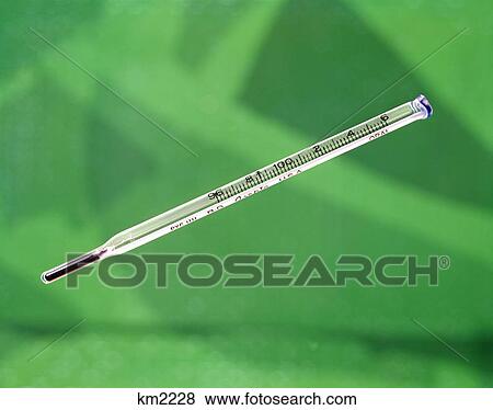 1960s 1970s still life thermometer green background temperature measurement illness medicine View Large Photo Image Stock Photo - 1960s 1970s still life thermometer green background temperature measurement illness medicine. Fotosearch
