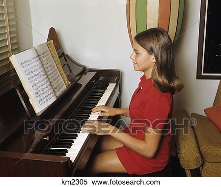 1960s 1970s teenage girl playing piano View Large Photo Image Stock Photography - 1960s 1970s teenage girl playing piano. Fotosearch