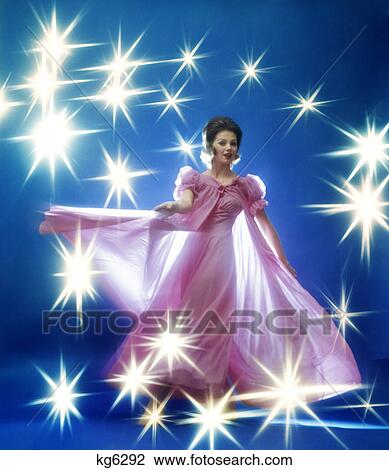 1960s 1970s woman brunette in rose gown dancing yellow stars special effect View Large Photo Image Stock Image - 1960s 1970s woman brunette in rose gown dancing yellow stars special effect. Fotosearch