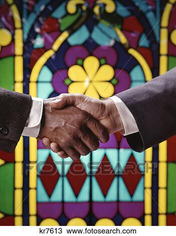 1960s african american and caucasian male handshake in front of stained glass window View Large Photo Image Stock Image - 1960s african american and caucasian male handshake in front of stained glass window. Fotosearch