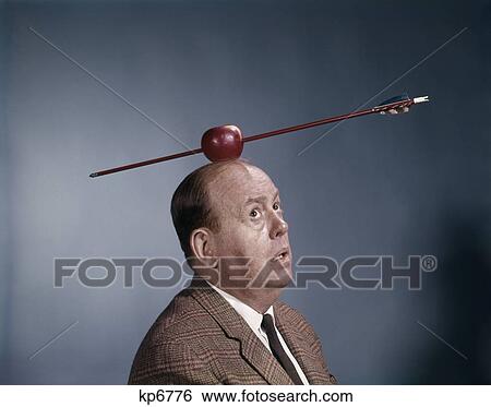 1960s anxious nervous man looking up at arrow in apple target top his head symbol william tell humor View Large Photo Image Stock Photograph - 1960s anxious nervous man looking up at arrow in apple target top his head symbol william tell humor. Fotosearch