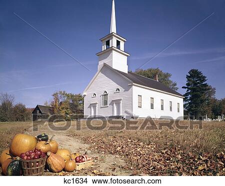 Picture - 1960s autumn church in burke hollow vt with harvest basket in foreground. Fotosearch