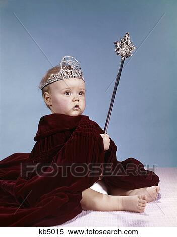 1960s baby girl wearing rhinestone tiara and red velvet cloak holding scepter View Large Photo Image Stock Photography - 1960s baby girl wearing rhinestone tiara and red velvet cloak holding scepter. Fotosearch
