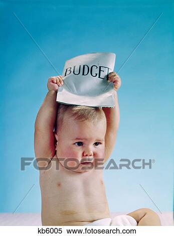 1960s baby holding budget sign above his head View Large Photo Image Stock Photography - 1960s baby holding budget sign above his head. Fotosearch