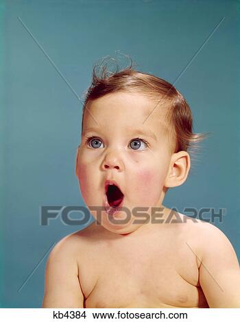 Picture - 1960s baby portrait mouth wide open facial expression of shock wonder horror surprise awe yawn sing. Fotosearch