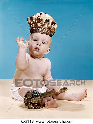 1960s baby wearing cloth diaper and crown of king holding a royal monarch scepter waving with one arm raised View Large Photo Image Stock Photo - 1960s baby wearing cloth diaper and crown of king holding a royal monarch scepter waving with one arm raised. Fotosearch