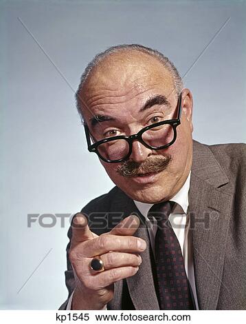 1960s balding elderly man eyeglasses moustache pointing finger View Large Photo Image Stock Photography - 1960s balding elderly man eyeglasses moustache pointing finger. Fotosearch