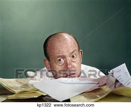 1960s balding middle aged man worried expression peeking over top papers bills paperwork View Large Photo Image Stock Image - 1960s balding middle aged man worried expression peeking over top papers bills paperwork. Fotosearch