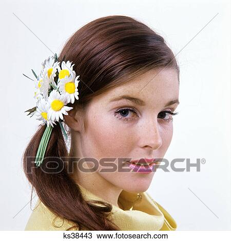 1960s brunette woman wearing artificial daisies daisy bouquet in hair portrait fashion beauty View Large Photo Image Stock Image - 1960s brunette woman wearing artificial daisies daisy bouquet in hair portrait fashion beauty. Fotosearch