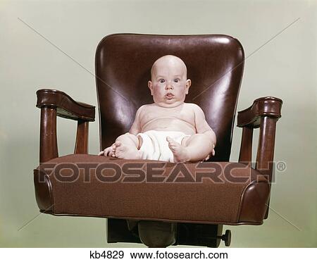 1960s chubby bald baby wearing cloth diaper sitting in executive office business chair View Large Photo Image Stock Photo - 1960s chubby bald baby wearing cloth diaper sitting in executive office business chair. Fotosearch