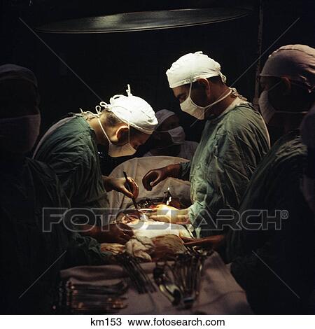 1960s doctors performing abdominal surgery in operating room View Large Photo Image Stock Image - 1960s doctors performing abdominal surgery in operating room. Fotosearch