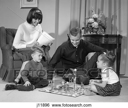 1960s family children playing game in living room mousetrap View Large Photo Image Stock Photograph - 1960s family children playing game in living room mousetrap. Fotosearch