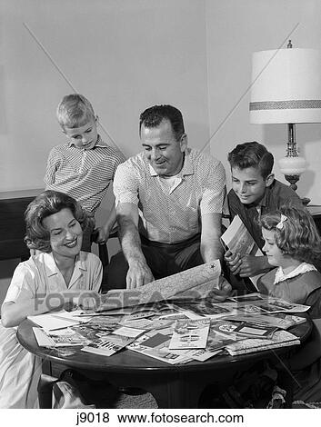 1960s family planning trip looking at maps mother father boys son View Large Photo Image Stock Photo - 1960s family planning trip looking at maps mother father boys son. Fotosearch