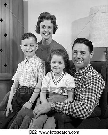 1960s family sitting on couch smiling View Large Photo Image Stock Image - 1960s family sitting on couch smiling. Fotosearch