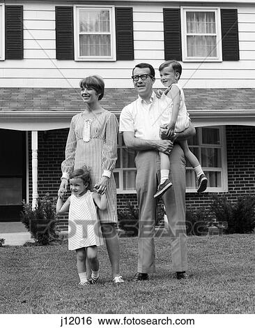 1960s family standing in yard by house View Large Photo Image Stock Photograph - 1960s family standing in yard by house. Fotosearch