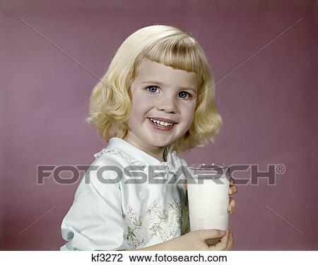 Stock Image - 1960s girl glass milk dairy smile. Fotosearch