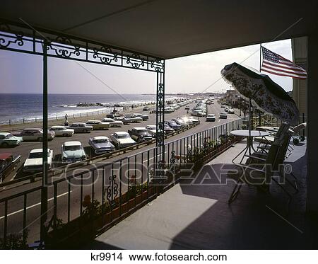 1960s hampton beach nh from patio balcony of hotel motel cars in parking lot View Large Photo Image Picture - 1960s hampton beach nh from patio balcony of hotel motel cars in parking lot. Fotosearch