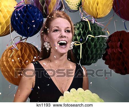 1960s laughing woman big pearl earrings with balloons and falling confetti and streamers View Large Photo Image Stock Image - 1960s laughing woman big pearl earrings with balloons and falling confetti and streamers. Fotosearch