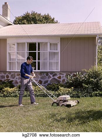 1960s lawnmower cutting grass yard work man View Large Photo Image Stock Photo - 1960s lawnmower cutting grass yard work man. Fotosearch