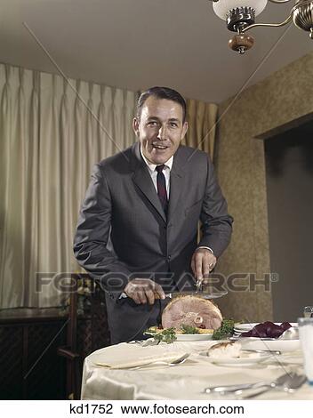 1960s man carving ham dinner View Large Photo Image Stock Image - 1960s man carving ham dinner. Fotosearch