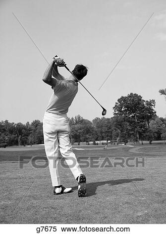 1960s man golf swing club View Large Photo Image Stock Photography - 1960s man golf swing club. Fotosearch