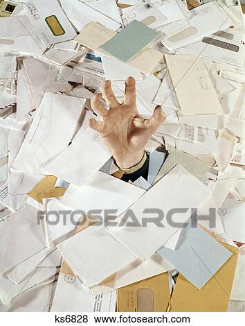 1960s man hand drowning reaching out pile of mail bills paper View Large Photo Image Stock Photo - 1960s man hand drowning reaching out pile of mail bills paper. Fotosearch