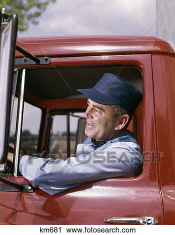 Stock Image - 1960s man truck driver delivery hat smile. Fotosearch