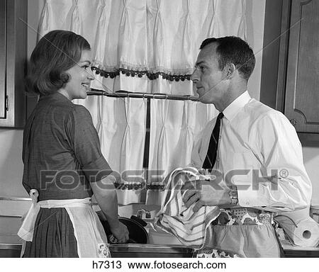 1960s man woman washing dishes kitchen View Large Photo Image Stock Image - 1960s man woman washing dishes kitchen. Fotosearch