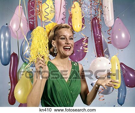 1960s party new year balloons woman streamers dress happy View Large Photo Image Stock Image - 1960s party new year balloons woman streamers dress happy. Fotosearch