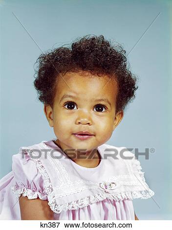 1960s portrait african-american girl toddler smiling happy wearing pink lacy dress View Large Photo Image Stock Photo - 1960s portrait african-american girl toddler smiling happy wearing pink lacy dress. Fotosearch
