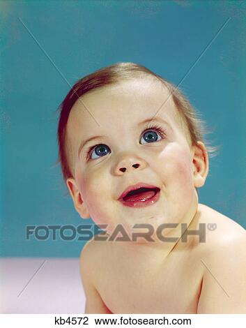 1960s portrait happy smiling baby looking up View Large Photo Image Stock Image - 1960s portrait happy smiling baby looking up. Fotosearch