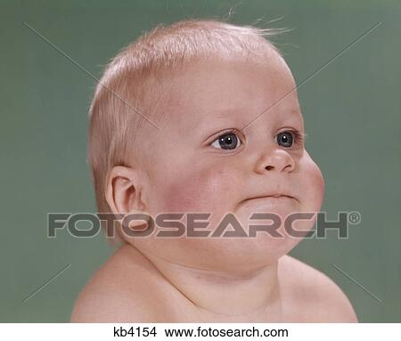 1960s portrait of blond baby chubby cheeks with funny face expression View Large Photo Image Picture - 1960s portrait of blond baby chubby cheeks with funny face expression. Fotosearch