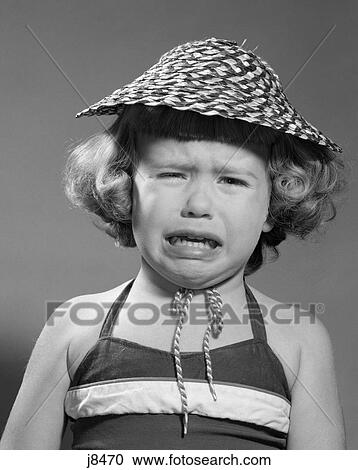 1960s portrait of girl wearing straw hat and crying View Large Photo Image Stock Image - 1960s portrait of girl wearing straw hat and crying. Fotosearch