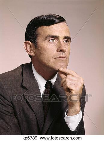 1960s portrait of thoughtful businessman with hand to his chin View Large Photo Image Stock Photo - 1960s portrait of thoughtful businessman with hand to his chin. Fotosearch