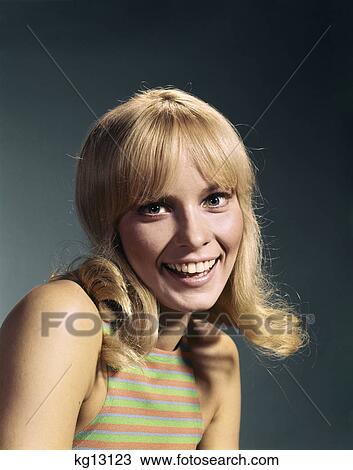 1960s portrait of young blond woman smiling wearing striped sleeveless top View Large Photo Image Stock Image - 1960s portrait of young blond woman smiling wearing striped sleeveless top. Fotosearch