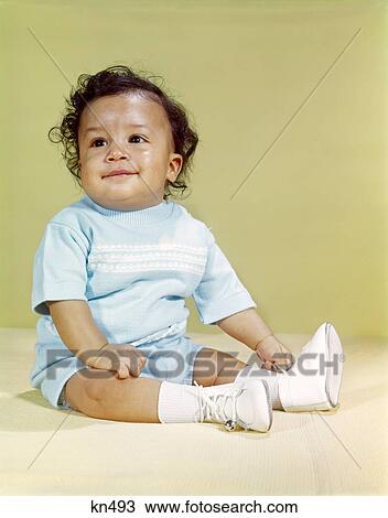 Stock Image - 1960s portrait smiling african-american baby boy. Fotosearch
