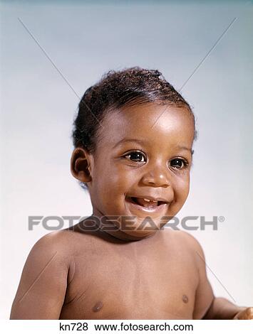 Stock Photo - 1960s portrait smiling african-american baby boy. Fotosearch