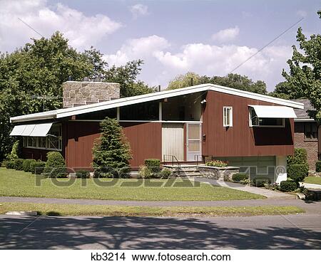 1960s red ranch style house with a stone chimney View Large Photo Image Picture - 1960s red ranch style house with a stone chimney. Fotosearch